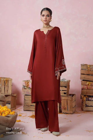 Red 2 piece herringbone set with a short shirt and shalwar, featuring urdu words.