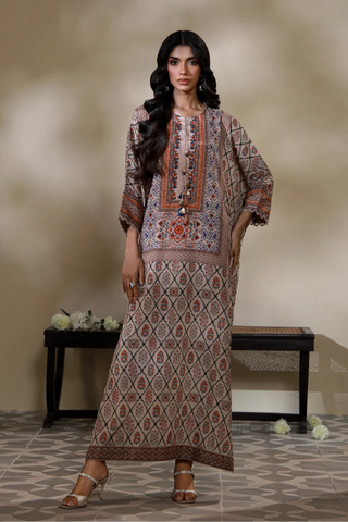 Manto's Alira long length Kaftaan in shades of sand, paired with straight pants. 