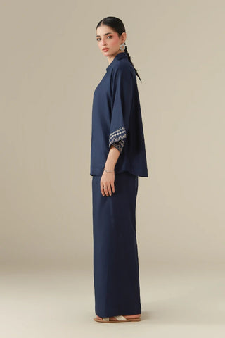 dobby crepe set featuring a short shirt, ijaar pants, and the words of Jaleel Manikpuri embroidered throughout.