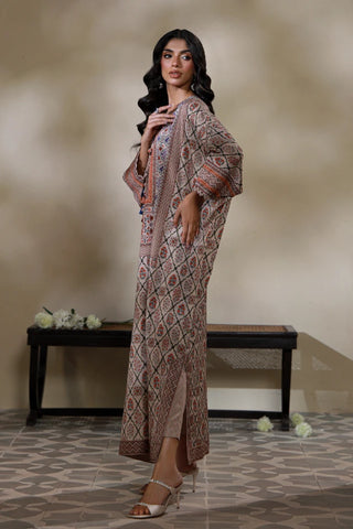Manto's Alira long length Kaftaan in shades of sand, paired with straight pants. 
