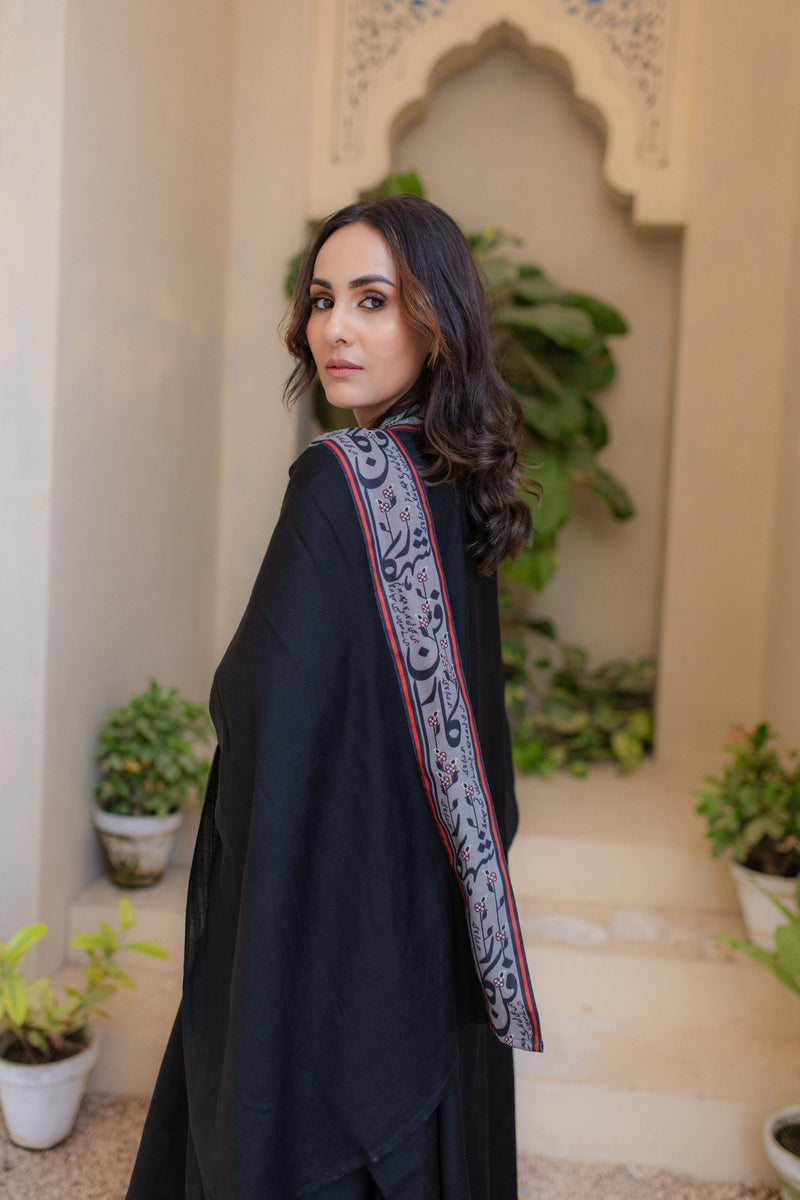 Shopmanto, wear manto, manto clothing brand, unisex cape shawl, cape shawl, men cape shawl, women cape shawl, capes, shawl, winter wear, eastern, western, urdu calligraphy on the cape shawl, cape in black, shahkaar cape, men outerwear, women outerwear, shahkaar cape black and grey, manto capes, manto shawl