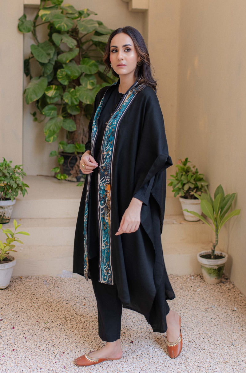 Shopmanto, wear manto, manto clothing brand, unisex cape shawl, cape shawl, men cape shawl, women cape shawl, capes, shawl, winter wear, eastern, western, urdu calligraphy on the cape shawl, cape in black, shahkaar cape, men outerwear, women outerwear, shahkaar cape black and teal, manto capes, manto shawl